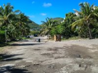 In general the roads were in pretty poor shape. This is Rue de Mt Vernon which leads from our condo to the main road. It&#39;s riddled with potholes and this day workers had come, mixed up some cement by hand and filled in several holes with shovels. To prevent people driving on their fresh repairs they place garbage cans, rocks, etc across the road.